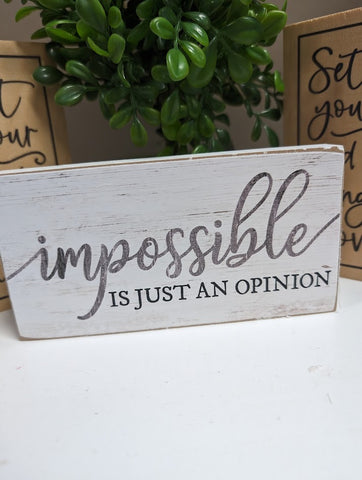 Shelf Sitter or Wood Block that proudly declares "impossible is just an opinion."